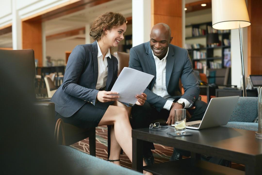 Advisor and client reviewing documents together during a consultation